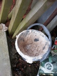 Bucket filled with hardened plaster